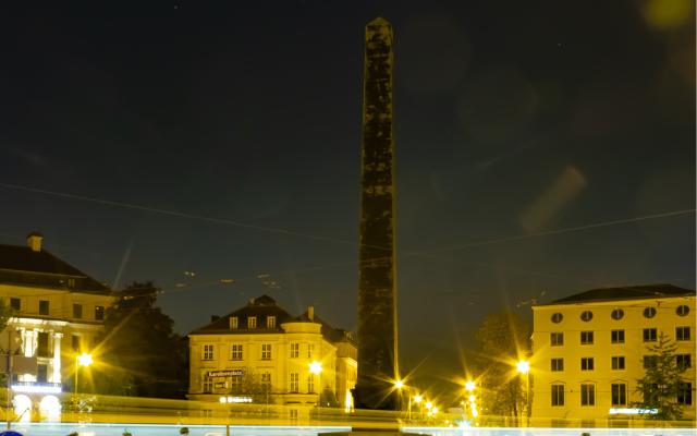 black obelisk on Karolinenplatz at night