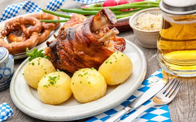 Schweinshaxe and dumplings image. This meal should be on your list of things to eat on your One Day In Munich for sure.