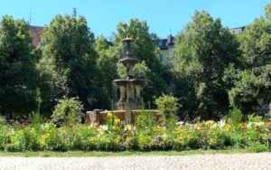 Weissenburger Platz Fountain and Square in Munich in the summertime.