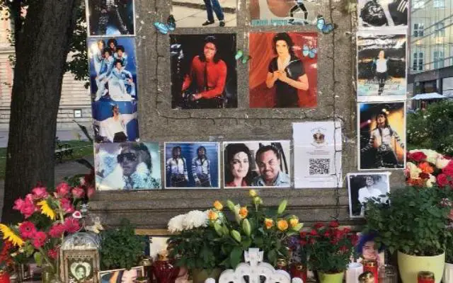 Why Is There A Michael Jackson Memorial in Munich featuring a shrine of pictures to Michael Jackson covered all over the plinth of a statue