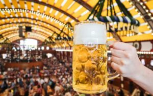 What is a Volksfest featuring a mass beer over a crowded beer tent