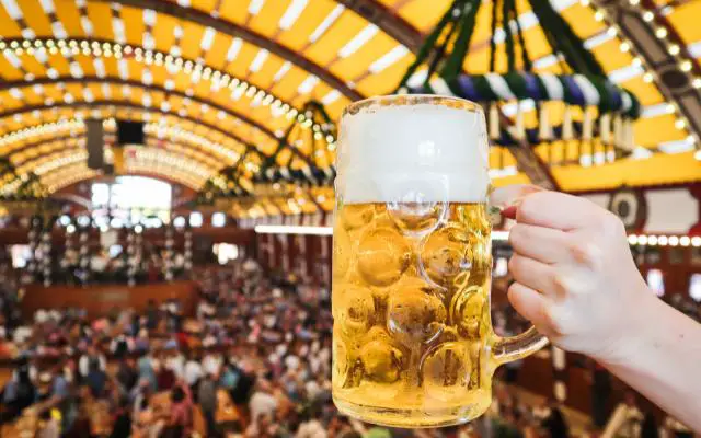 What is a Volksfest featuring a mass beer over a crowded beer tent