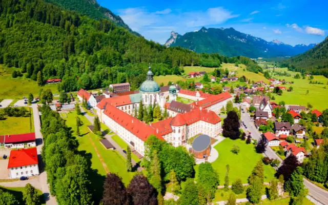 Ettal Abbey Monastery on beautiful day with blue sky taken from drone