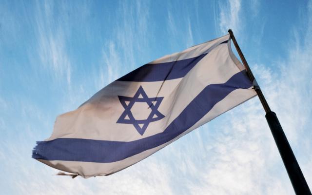 Jewish Museum Munich external flag flying against a blue and white sky. Jüdische Museum München