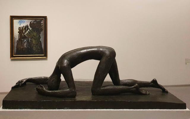 Pinakothek Der Moderne sculpture of man and painting